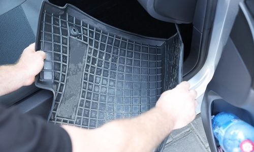 Man,Taking,Black,Rubber,Car,Mat,From,Auto,,Closeup